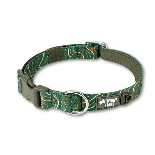 Twiggy Tags Apex Dog Collar in Nomad pattern. The pattern i dark green woth white contour lines and small orange trig points