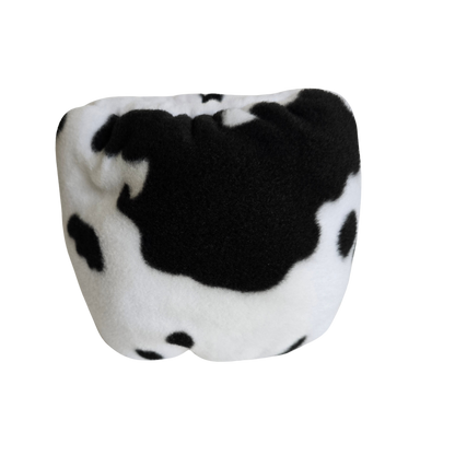Cow Print Hush Muff  Comfortable Fleece Sound and noise reducing head gear for anxious dogs available at Track and Trail Canine Outfitters